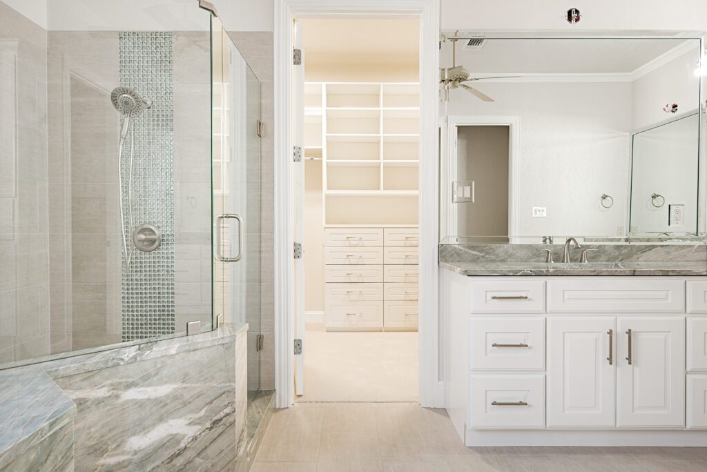 Completed luxury bathroom remodeling in Fort Worth, TX project with dual quartz vanity and custom tile shower enclosure.